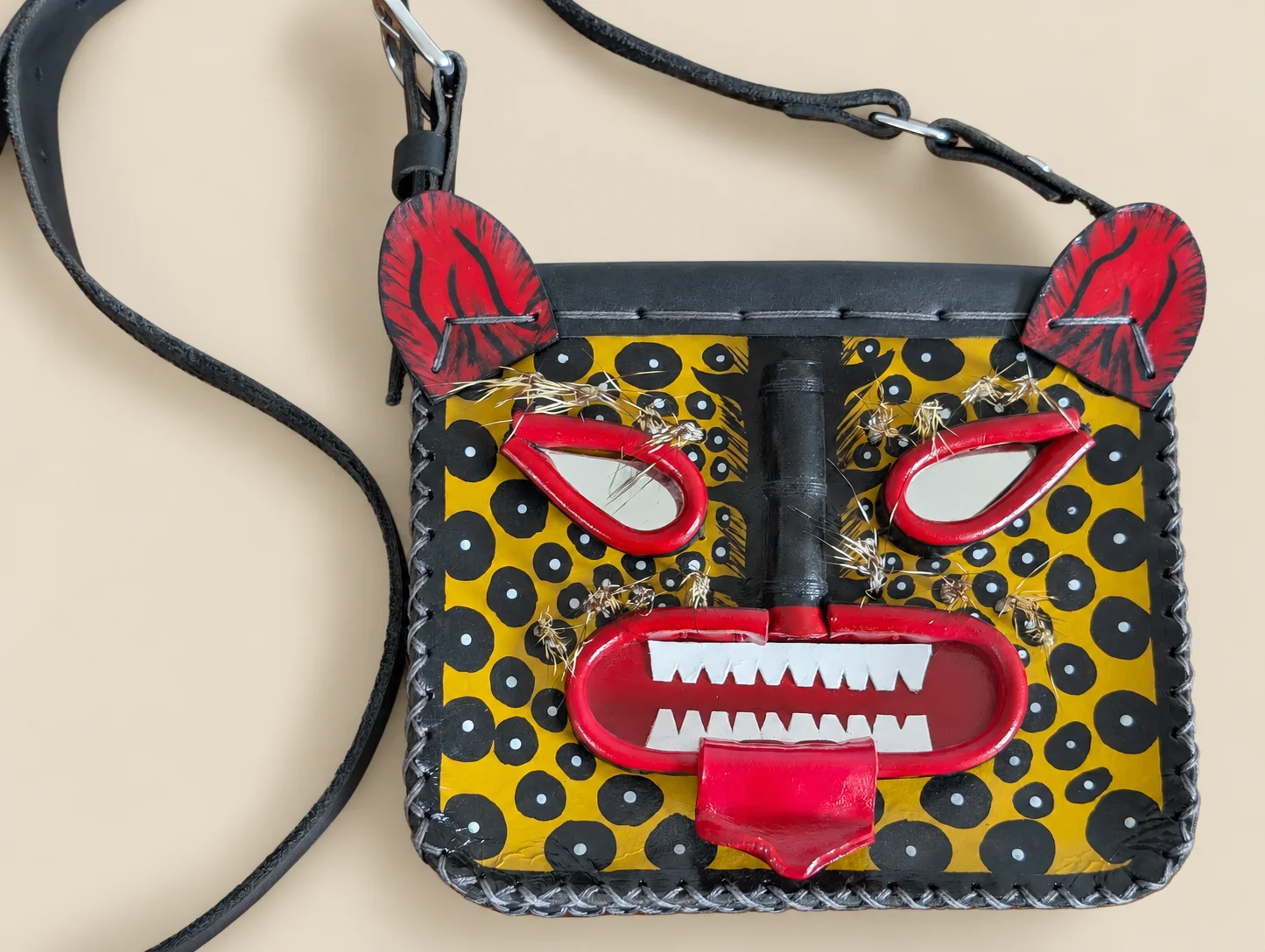 Painted leather jaguar mask bag